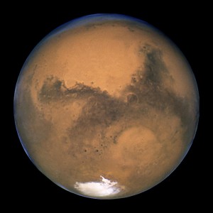 Mars as seen from the Hubble Space Telescope, showing the Hellas Basin at bottom right.
